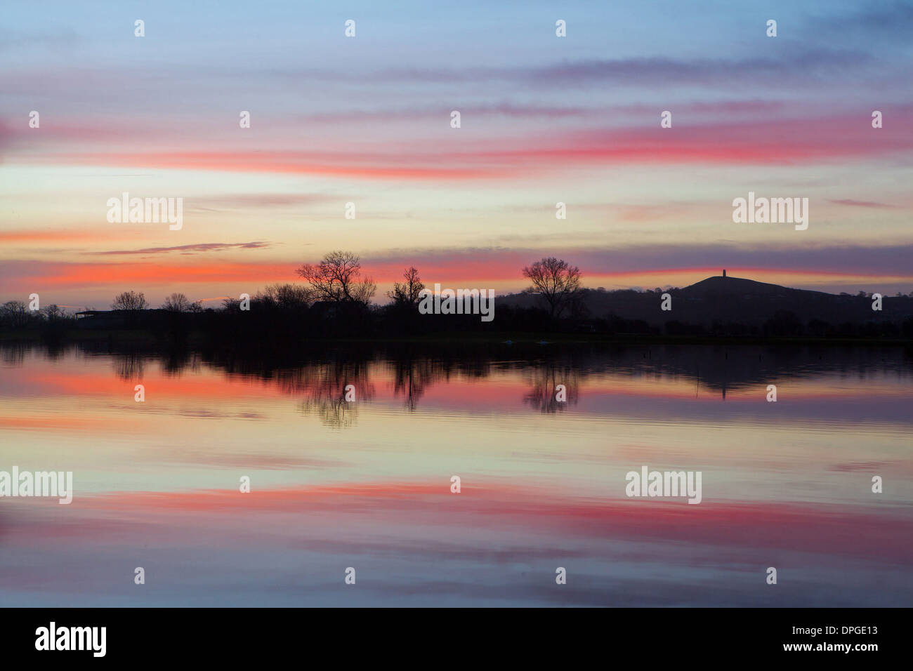 Glastonbury Tor is reflected in flooded fields Stock Photo