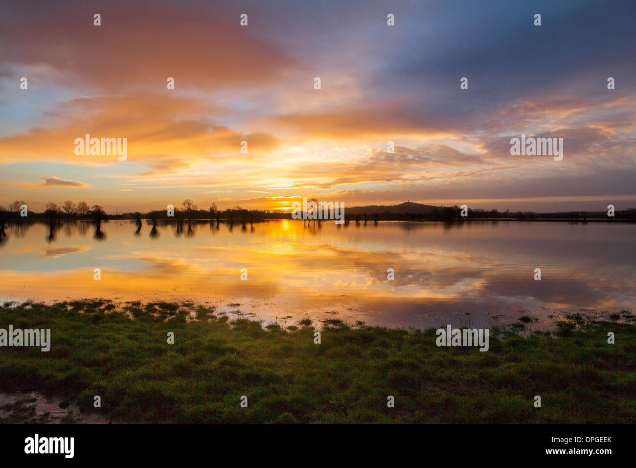 Glastonbury Tor is reflected in flooded fields Stock Photo