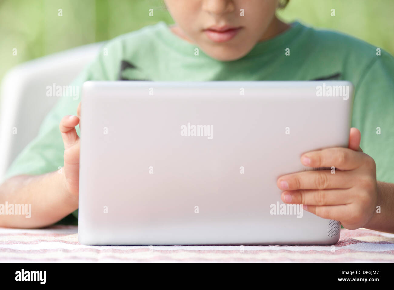 Boy using digital tablet Stock Photo