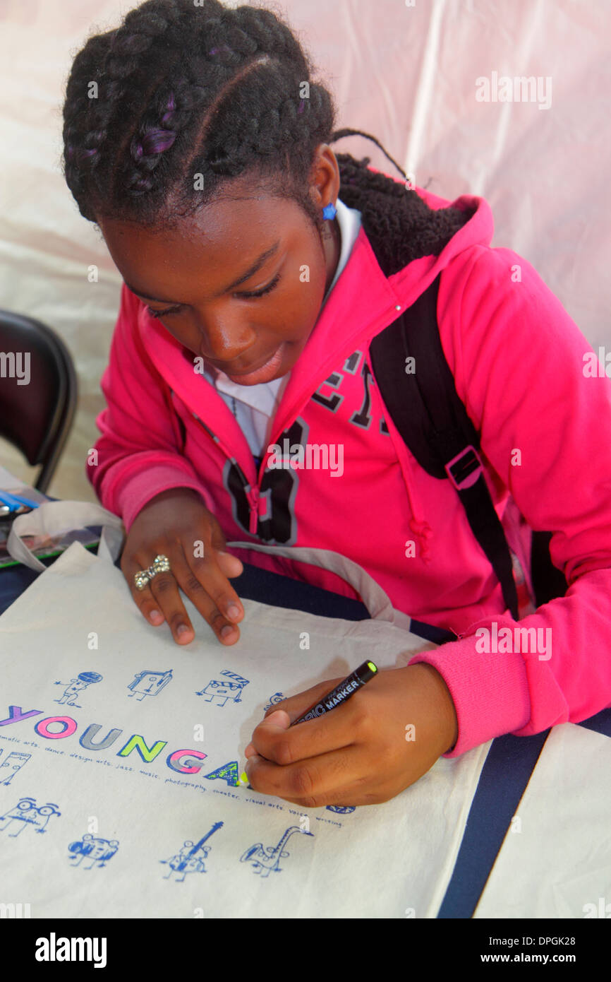 Miami Florida,Book Fair International,Miami Dade College,festival,Black girl girls,youngster,female kids children student students coloring,colouring, Stock Photo