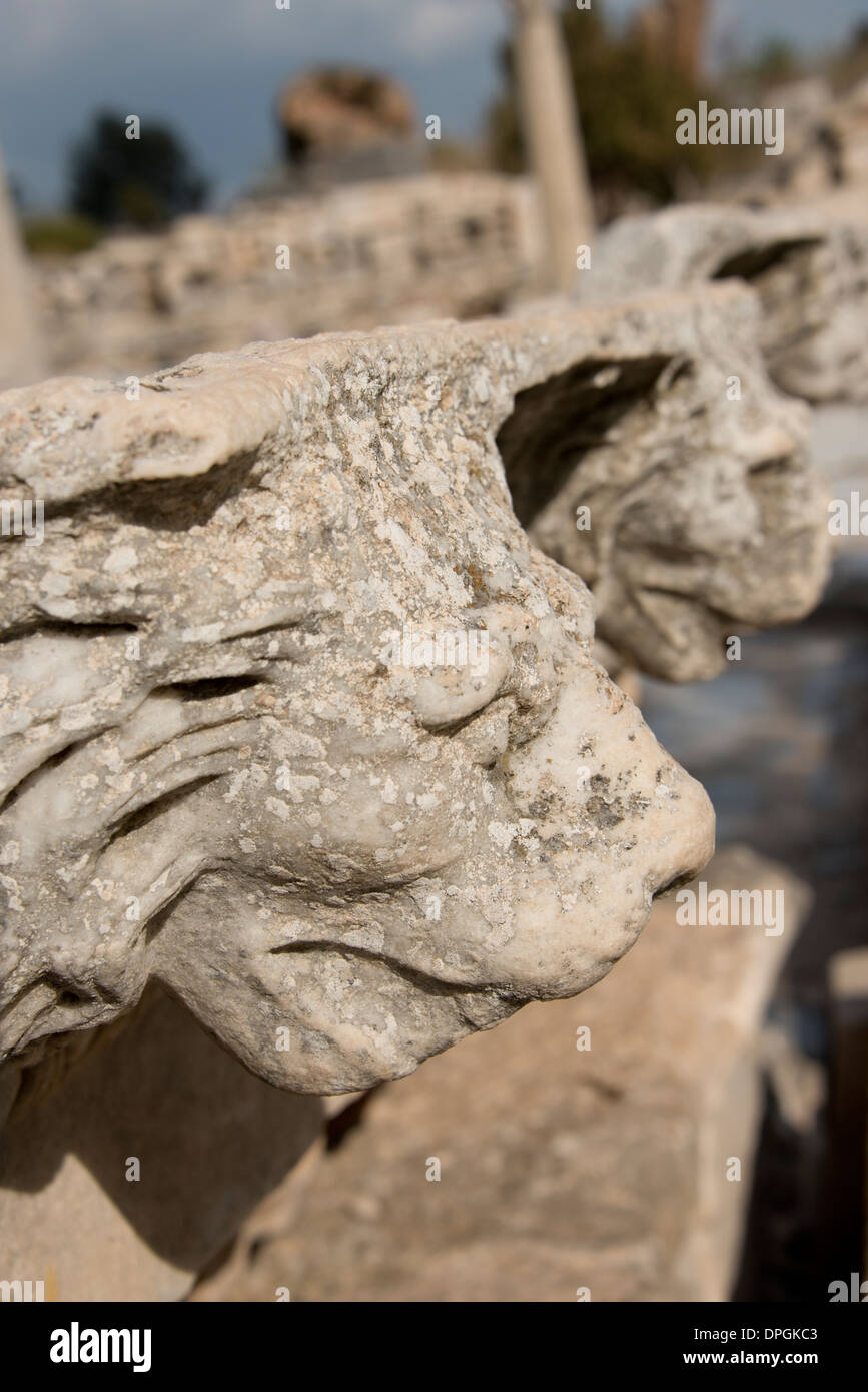 Turkey, Kusadasi, Ephesus. Carved marble lion head on ancient ruins along the 'Marble Way.' Stock Photo