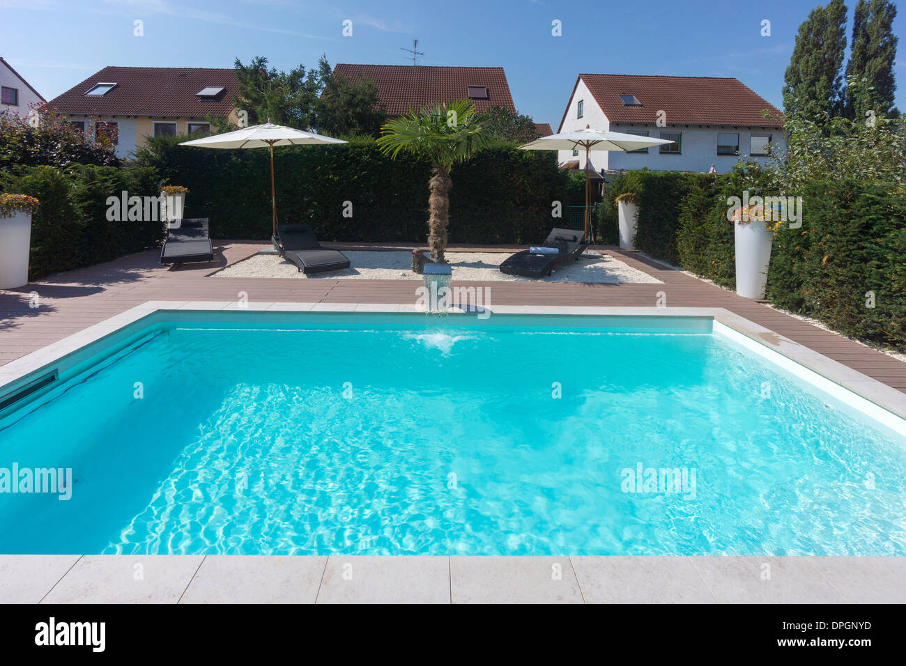 Private garden with pool and terrace in summer, Germany, Europe - August 2013 Stock Photo