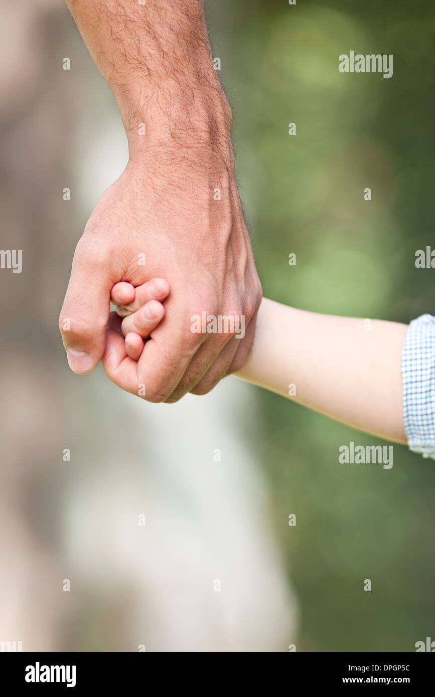 Father holding child's hand Stock Photo Alamy