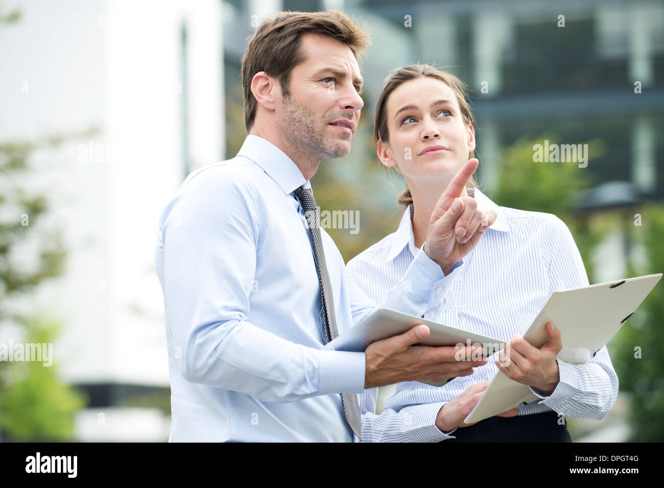 Business associates collaborating using digital tablet Stock Photo