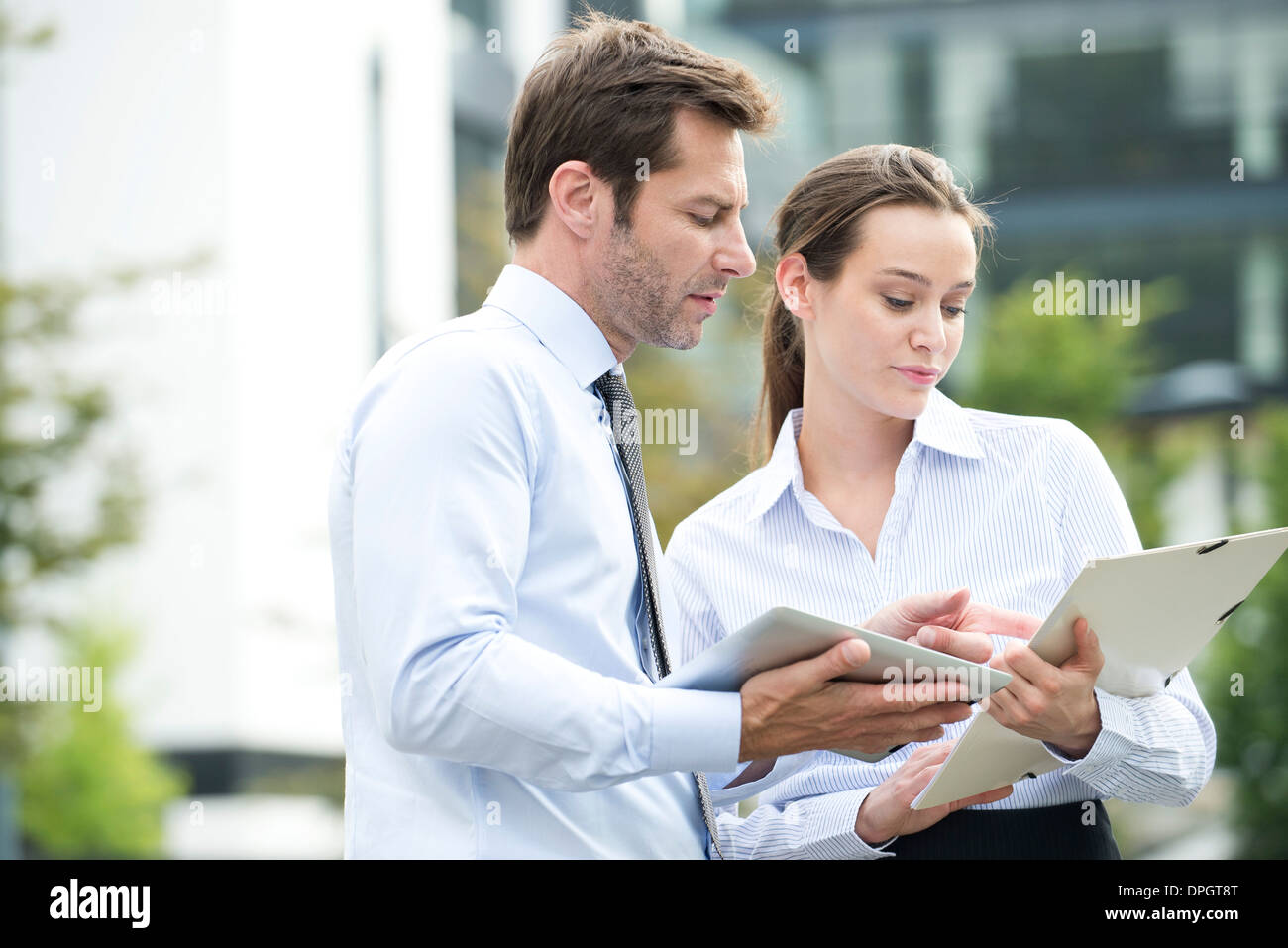 Business associates collaborating using digital tablet Stock Photo