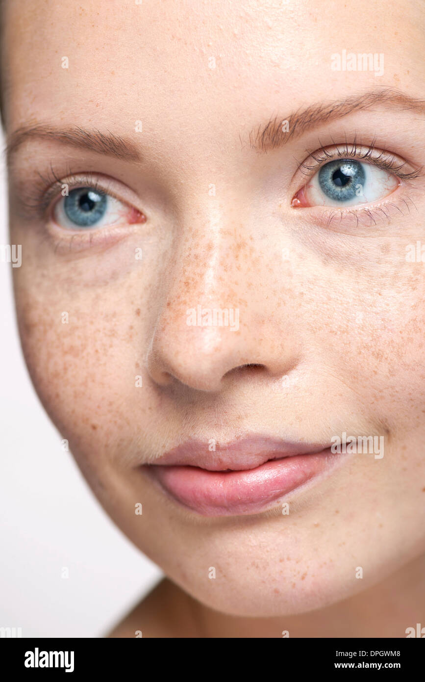 Young woman looking away, close-up portrait Stock Photo