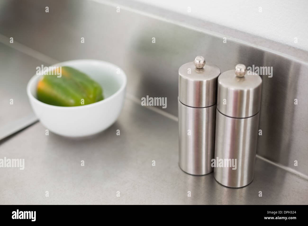 Salt and pepper on a chrome counter Stock Photo Alamy