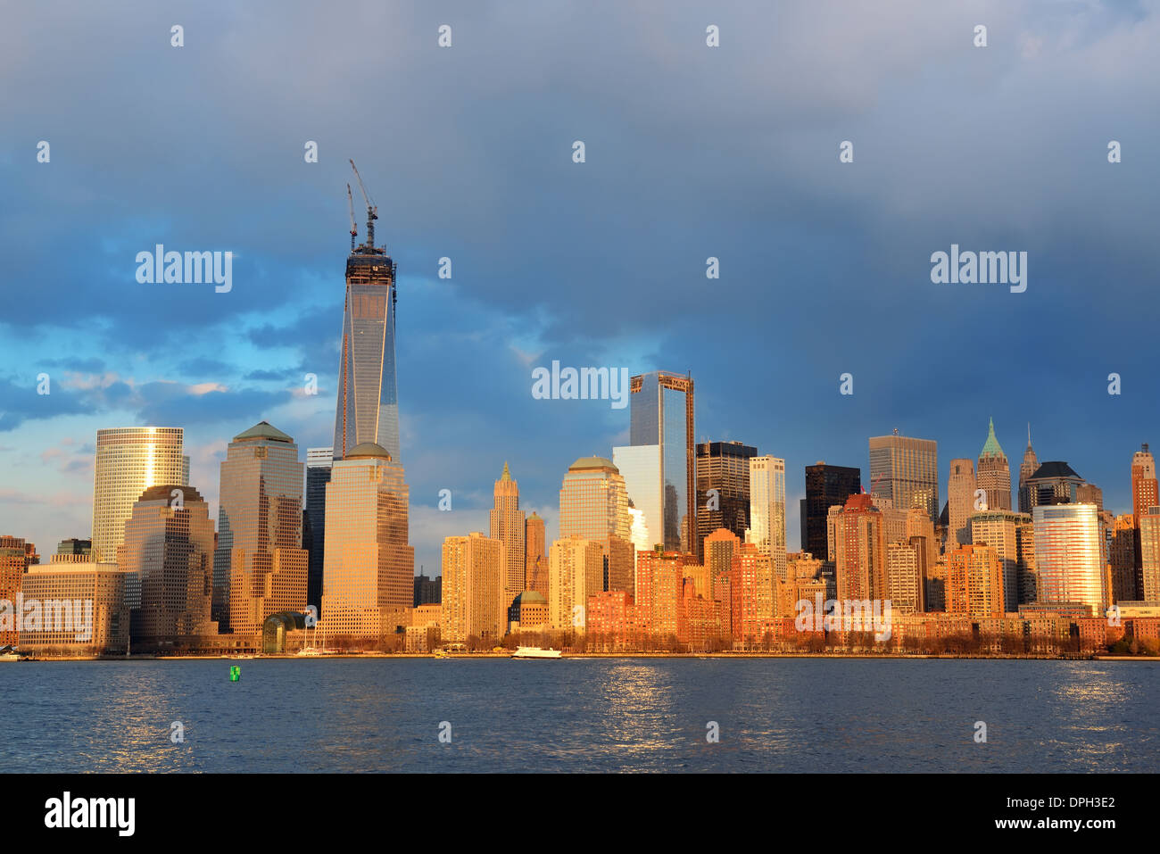 Downtown Manhattan skyline at sunset over Hudson River in New York City ...