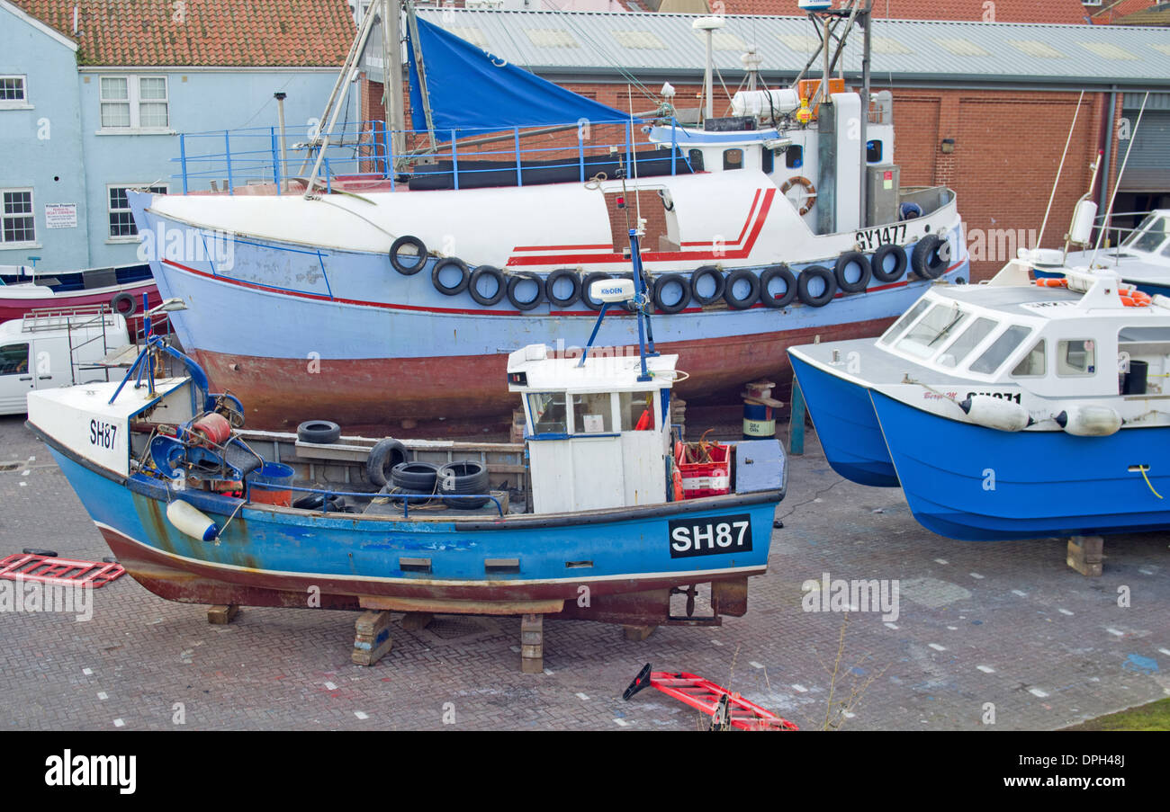 North Sea Fishing boats ashore in dry dock laid up.  Bridlington East Yorkshire UK Stock Photo