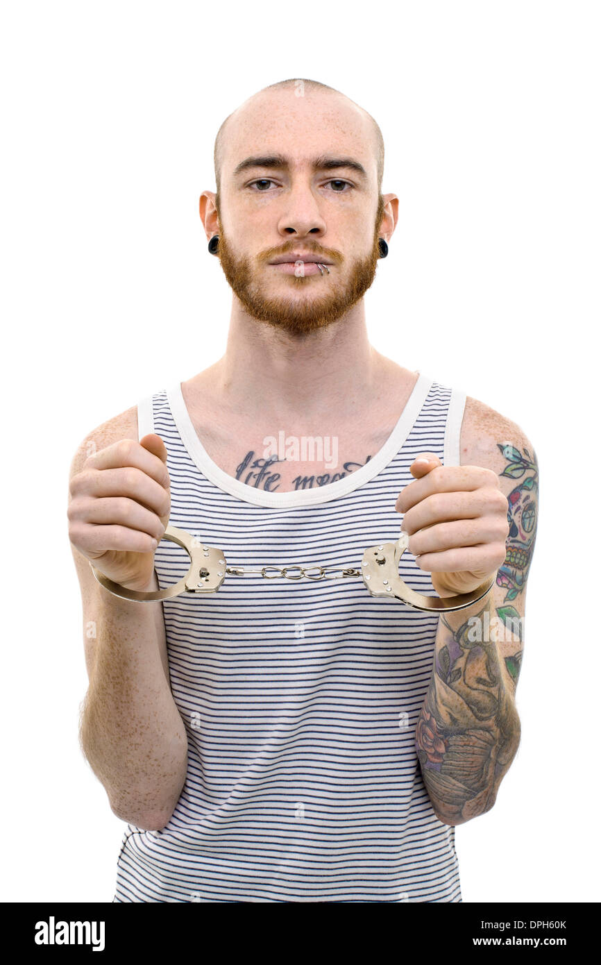 Young man in handcuffs Stock Photo - Alamy