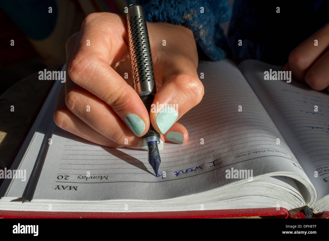 Writing with ink pen Stock Photo