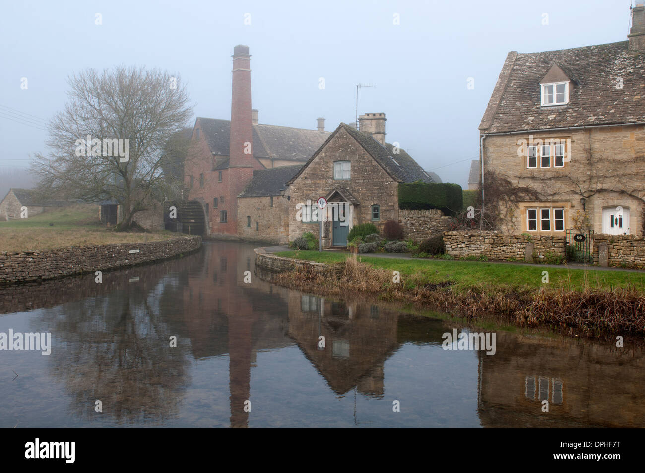 Lower Slaughter village, foggy weather, Gloucestershire, UK Stock Photo