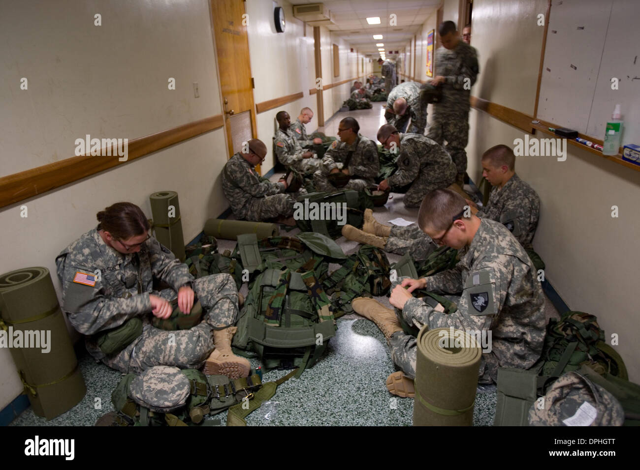 Jul. 13, 2006 - West Point, New York, U.S. - On day 5 of Cadet Basic Training, some of the New Cadets in Bravo Company sit in the hallway of Eisenhower Barracks while putting together equipment they need for their road march the following day. The year 2006 marks 30 years of women at West Point, United States Military Academy (USMA), as well as all the military academies. In 1975 P Stock Photo