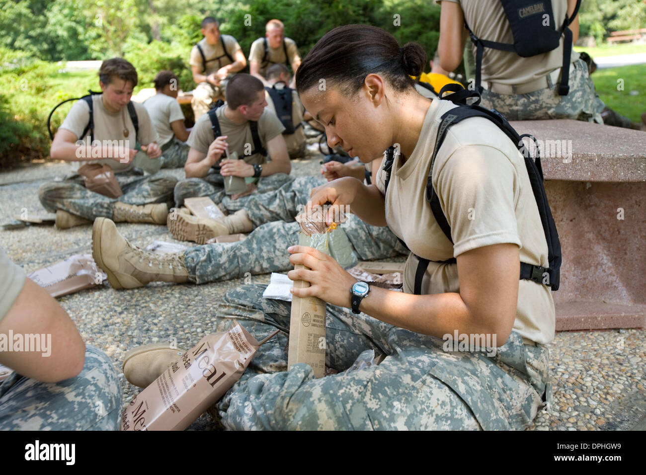 Jul. 13, 2006 - West Point, New York, U.S. - Echo Company breaks for lunch after the Warrior Competition during the Cadet Basic Training at West Point. The competition takes half a day and requires a company to break down squads to various different stations of physical tasks. Today, unless they were prior service, the New Cadets experience a Meal Ready to Eat (MRE) for the first t Stock Photo