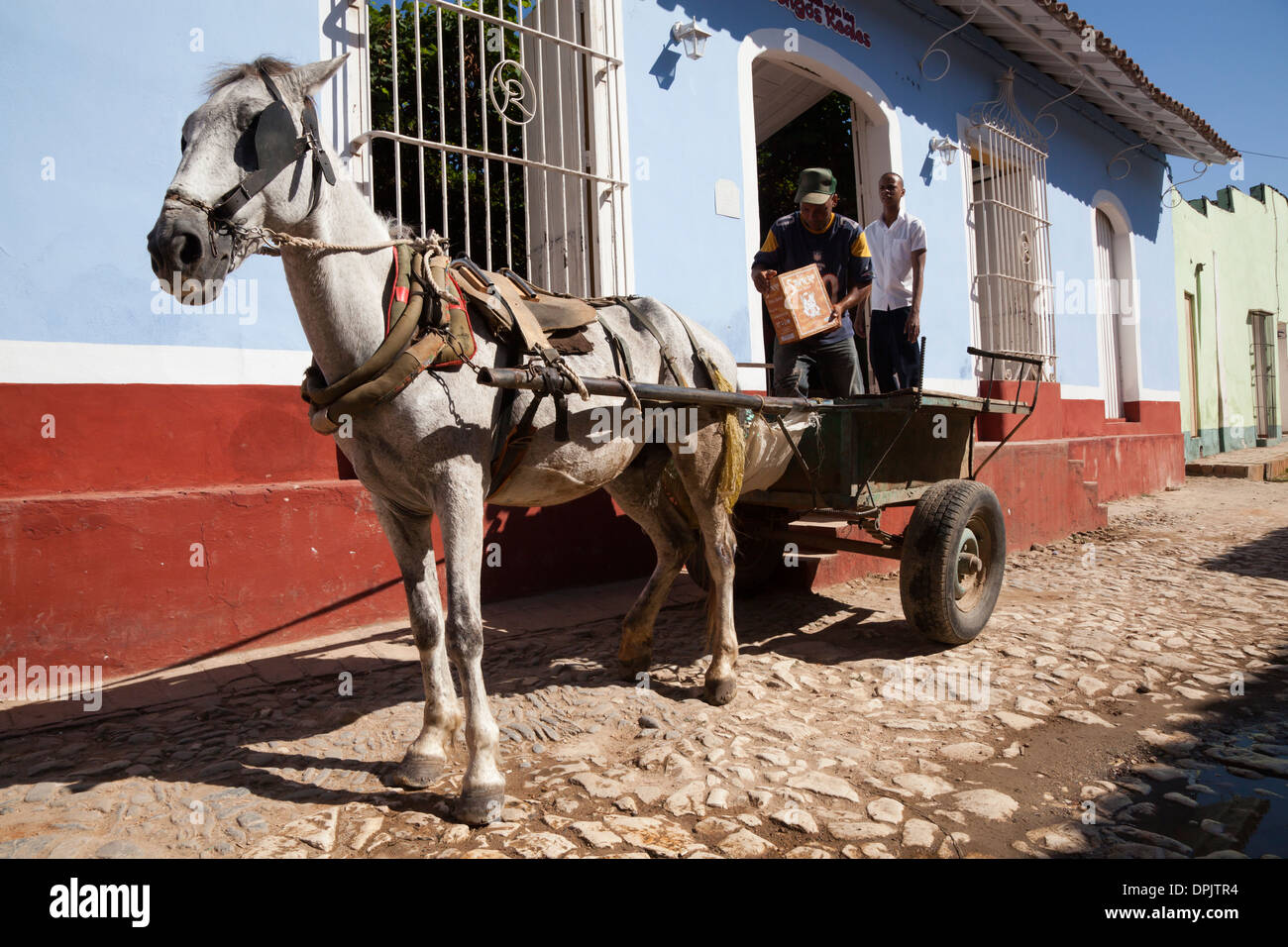 Loading cart in the streets of Trinidad, Cuba Stock Photo