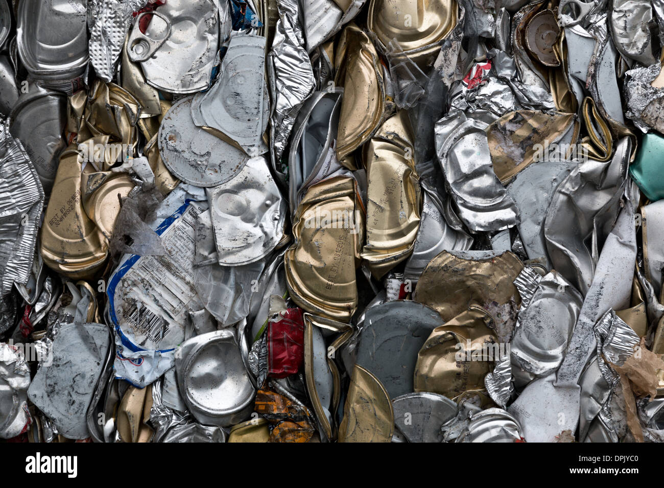 Closeup of crushed tin cans on their way to be melted down for