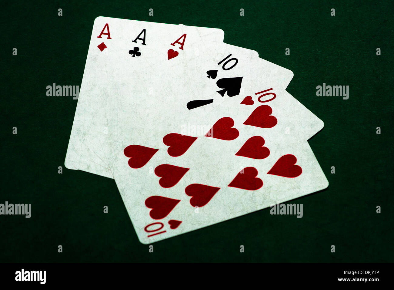 Poker Hands - Full House 2. Closeup view of five playing cards forming the poker full house hand Stock Photo