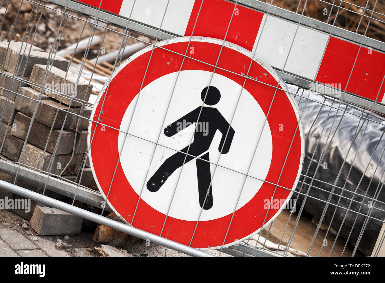 Under construction. Red and white restricted area sign on metal border Stock Photo