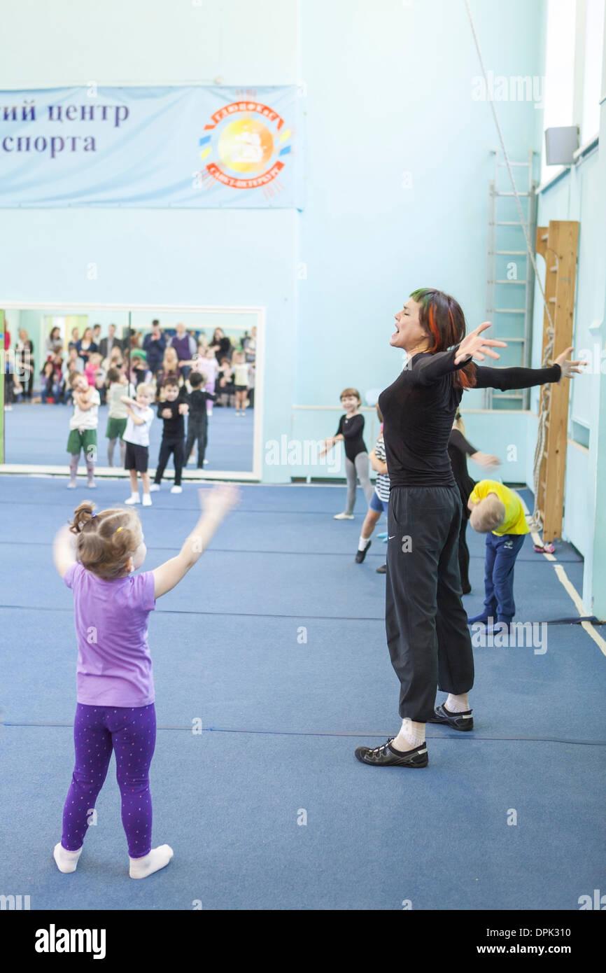 Russian sport school for children, gymnastic. Open lesson for parents watching Stock Photo