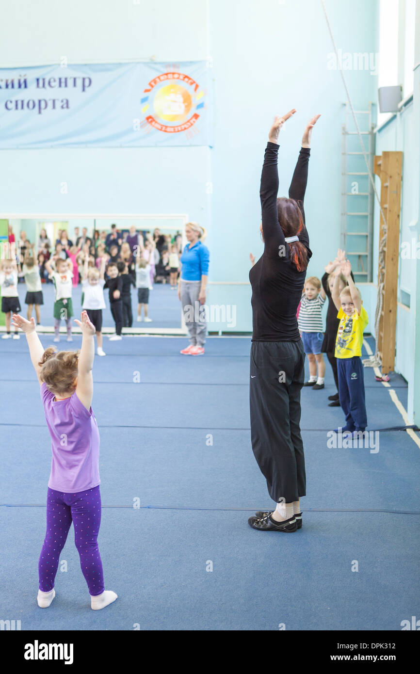 Russian sport school for children, gymnastic. Open lesson for parents watching Stock Photo