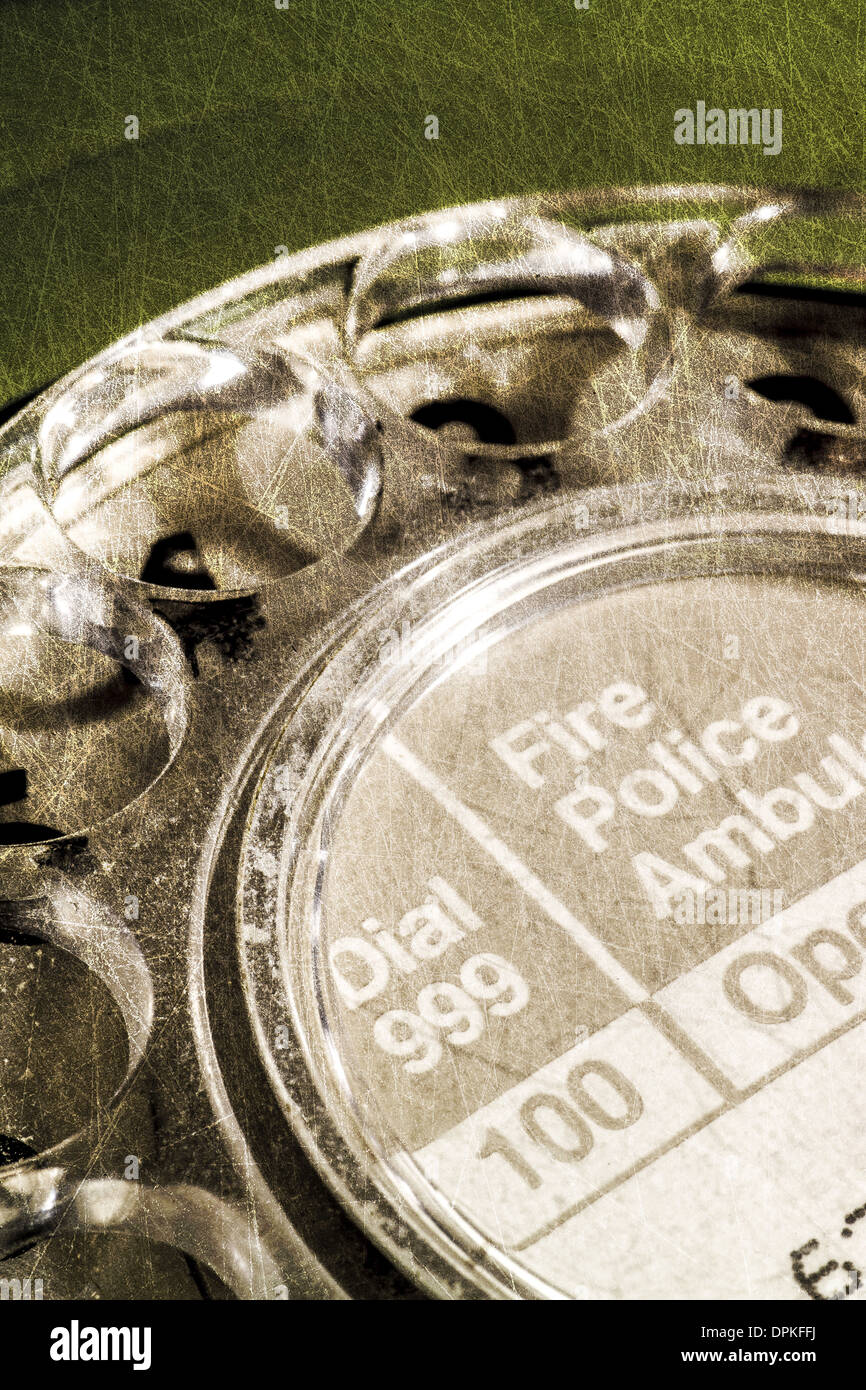 Green retro style GPO 746 telephone close up with emergency numbers Stock Photo