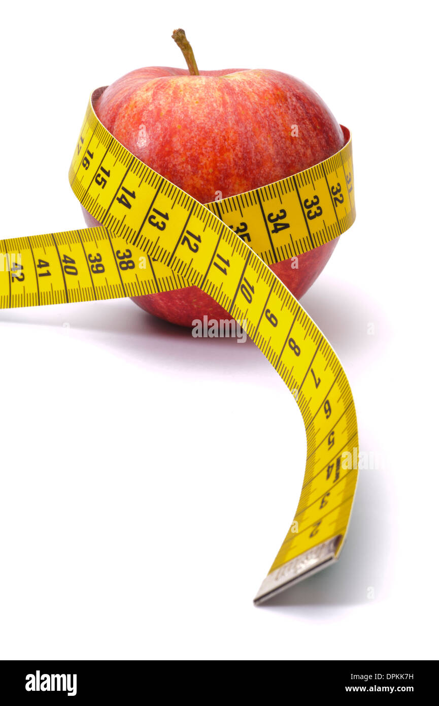 apple with measure tape as symbol for diet and weight control Stock Photo