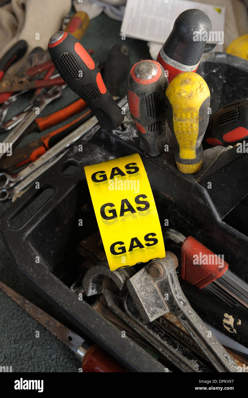 yellow gas safety tape in a gas engineers toolbox Stock Photo