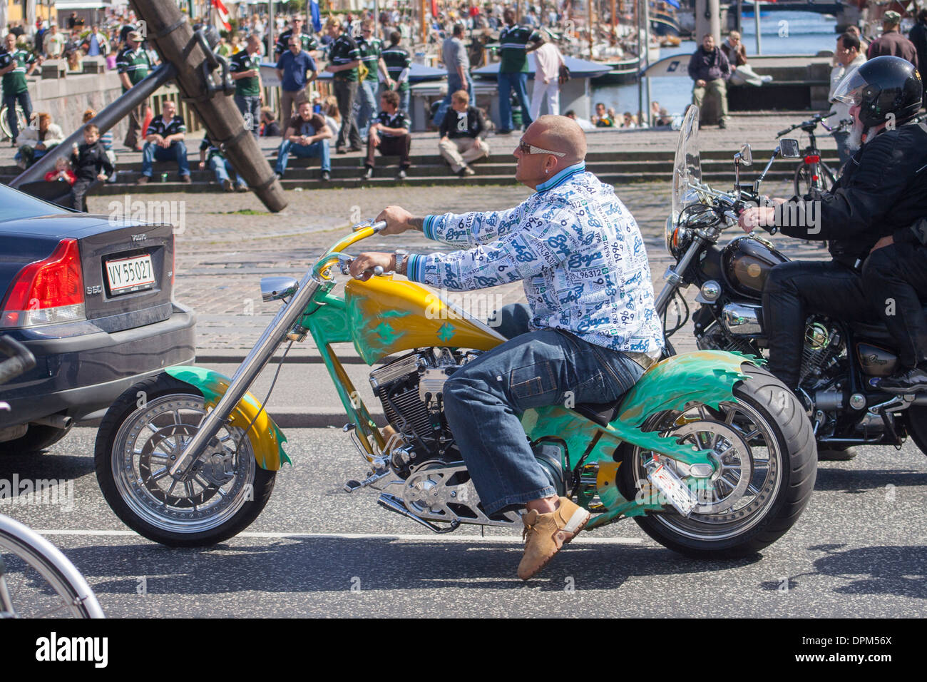 Middle-aged man riding Harley Davidson syle motorbike at Nyhavn, Copenhagen, Denmark Stock Photo