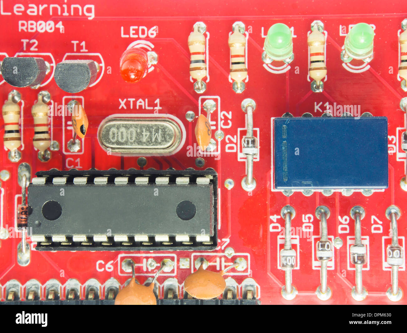 Red circuit board with chip Stock Photo