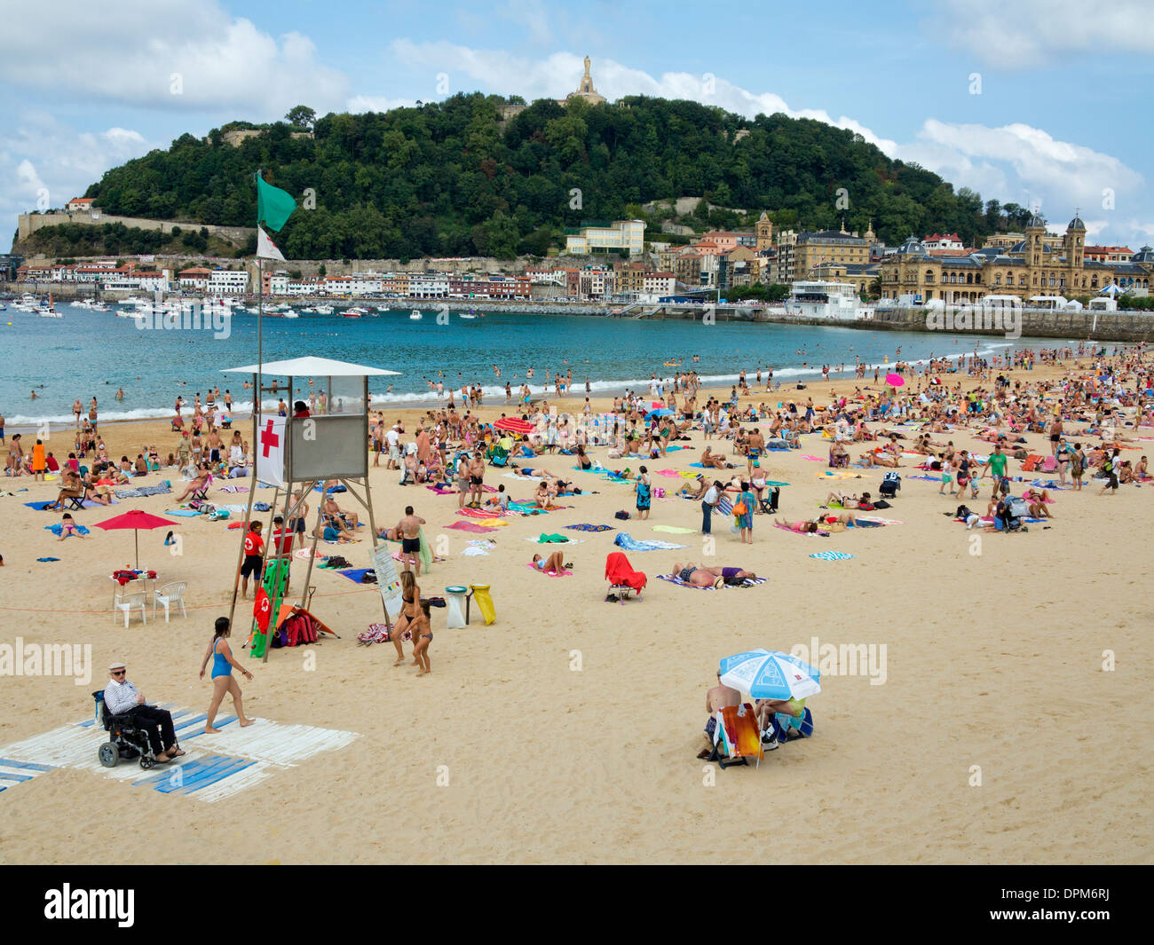 Families, swimmers and sunbathers relaxing at the weekend on La Concha