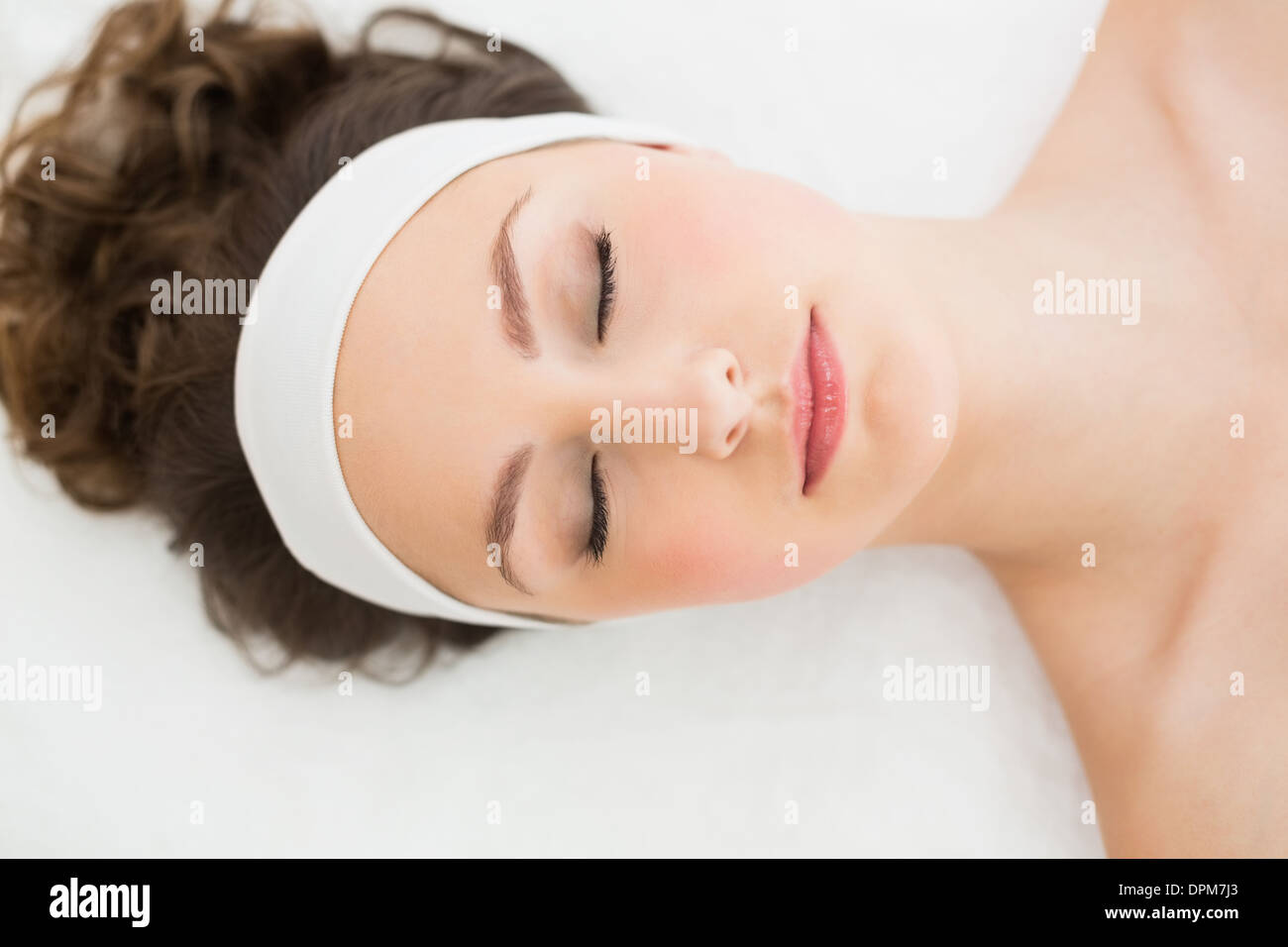 Brunette with eyes closed in beauty salon Stock Photo - Alamy