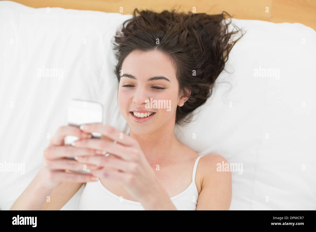 Relaxed young woman touching hair hi-res stock photography and images ...
