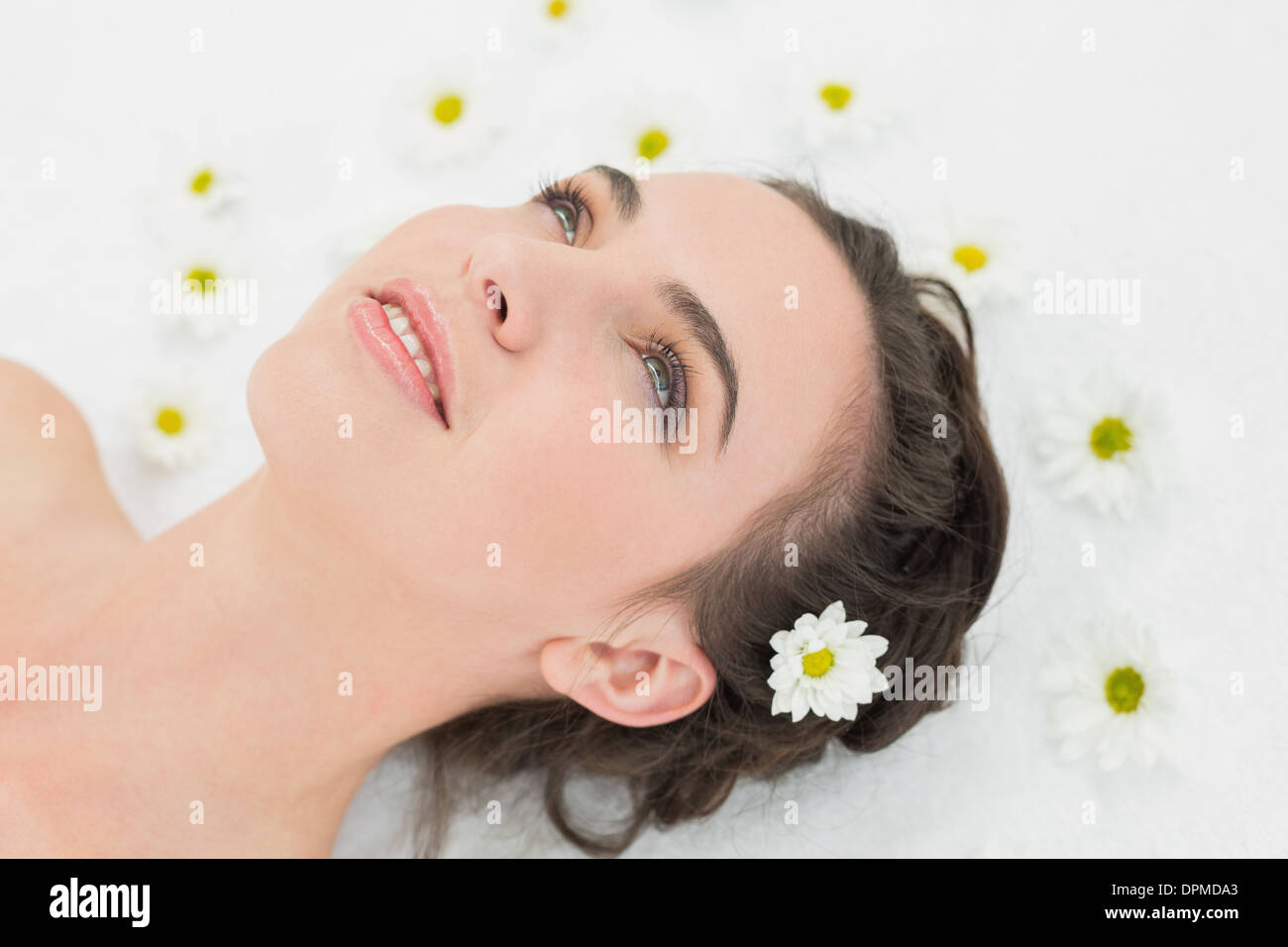 Beautiful woman with flowers in beauty salon Stock Photo - Alamy