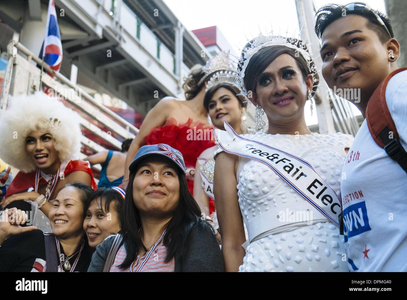 Bangkok, Thailand. 13th Jan, 2014. Anti-government protesters pose with a group of ladyboys (Thai transvestites), during the first day of the shutdown of the Thai capital. The blockade of Bangkok is the last attempt by royalists and the urban middle class to force out the elected government of Yingluck Shinawattra. Credit:  Thomas De Cian/NurPhoto/ZUMAPRESS.com/Alamy Live News Stock Photo