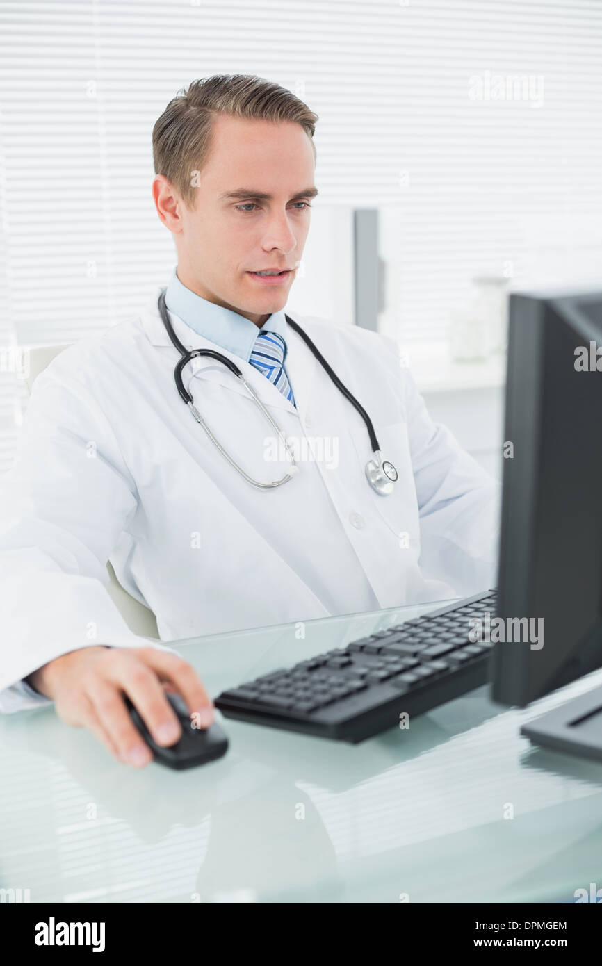 Doctor using computer at medical office Stock Photo Alamy