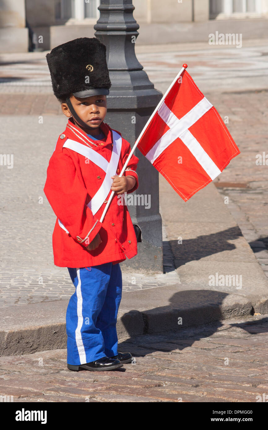 Boy dressed up as Royal guard at Amalienborg Palace on the Queen's Birthday, Copenhagen, Denmark Stock Photo