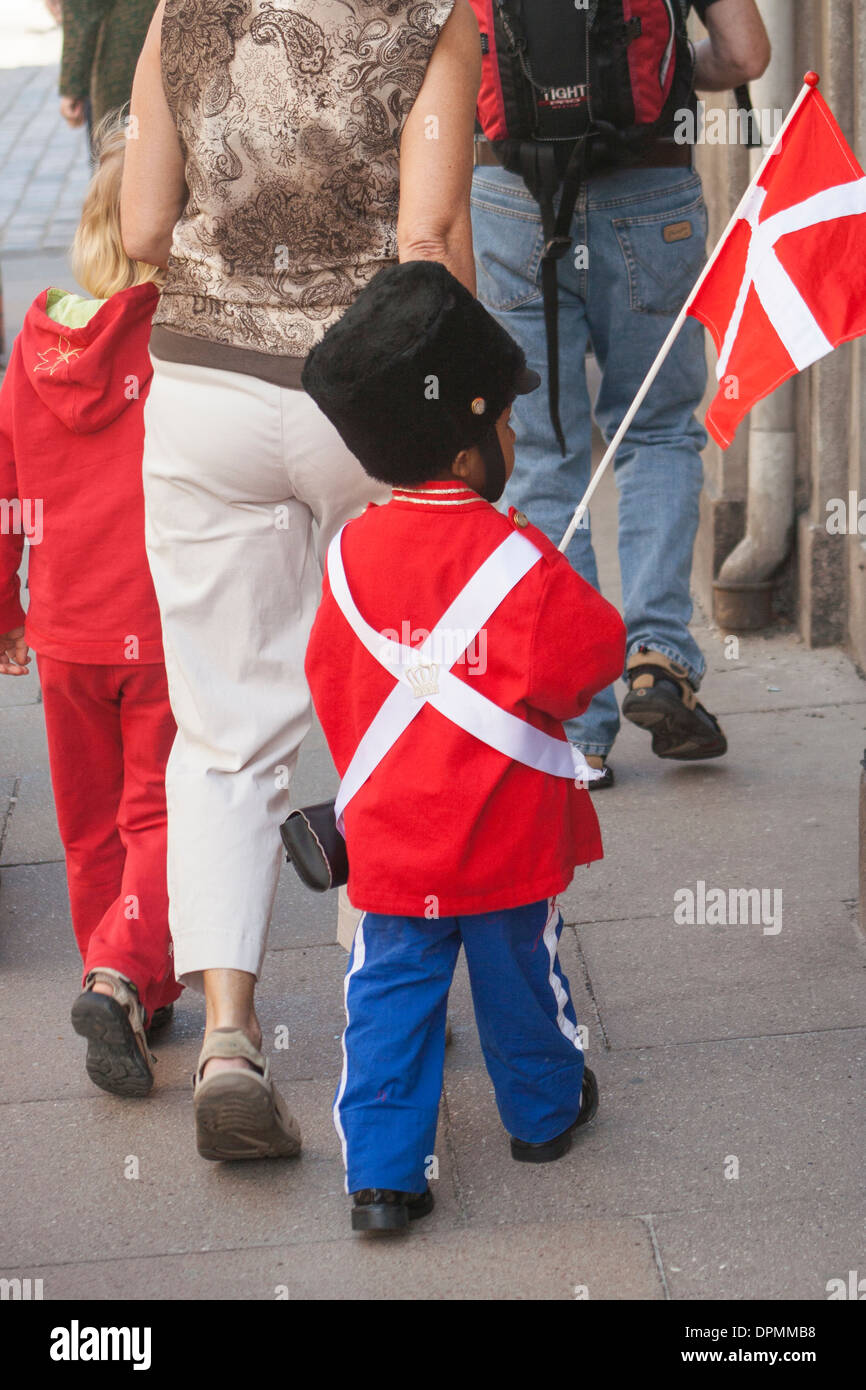 Boy dressed up as Royal guard near Amalienborg Palace on the Queen's Birthday, Copenhagen, Denmark Stock Photo