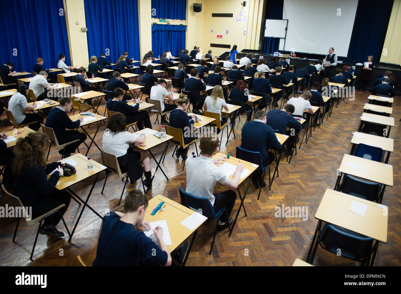Welsh teenage GCSE school pupils sitting exams in a school hall, Wales UK Stock Photo