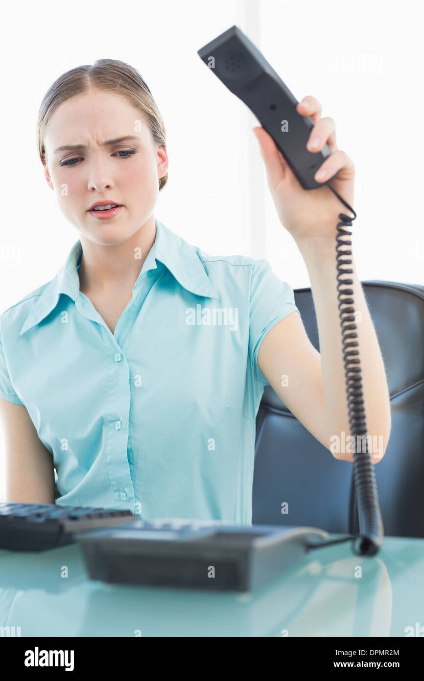 Classy angry businesswoman hanging up phone Stock Photo Alamy