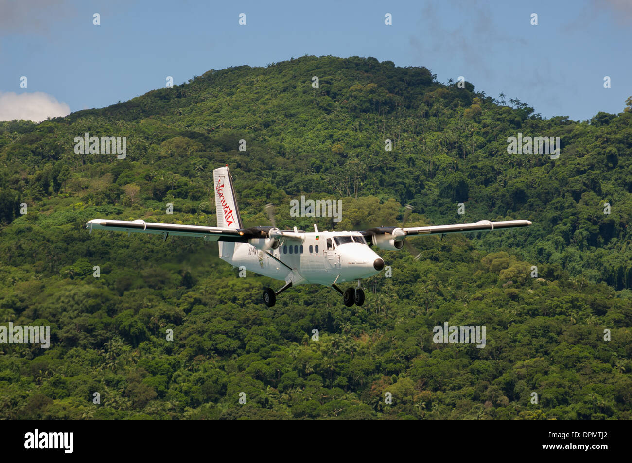 Vanuatun Airlines Turbo-prop plane coming in to land at a bush airport on Male Kula, Vanuatu Stock Photo