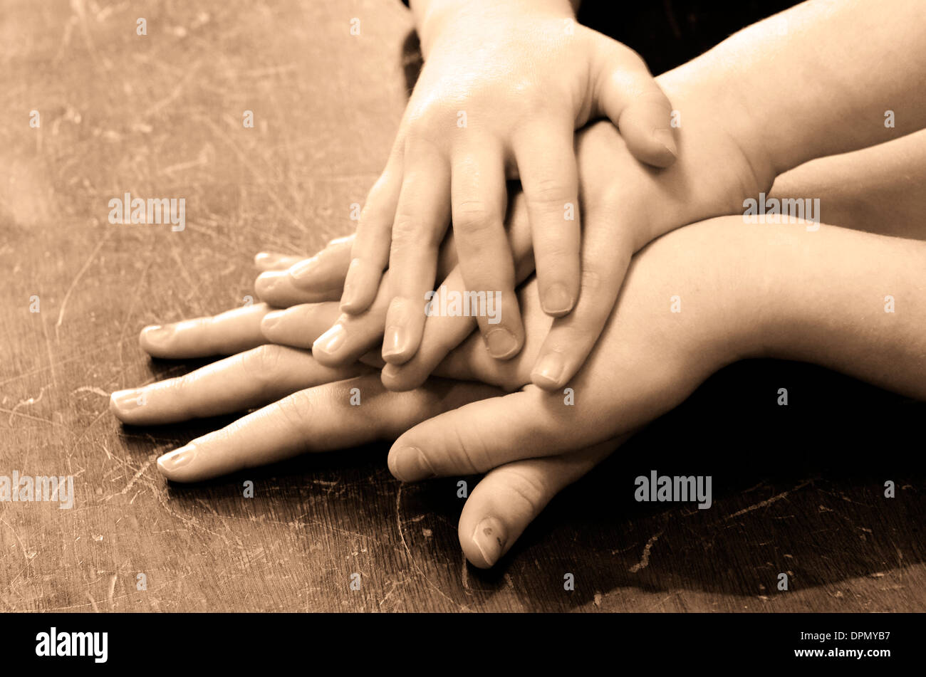 Several children hands on top of each other Stock Photo