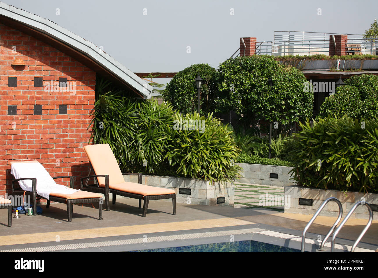 Luxurious swimming pool area on the hotel rooftop in Bangladesh Stock Photo