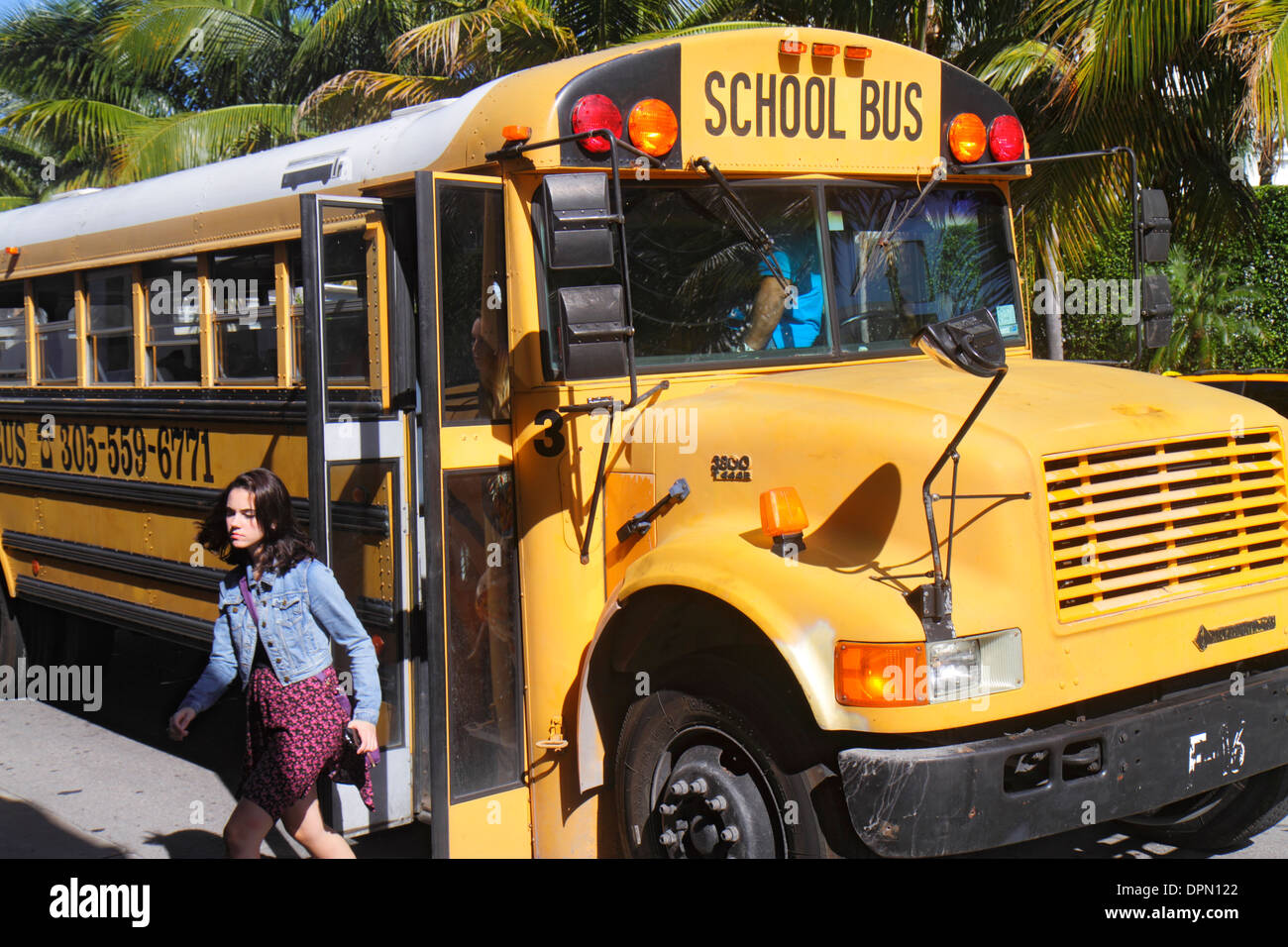 Miami Beach Florida,school bus,coach,girl girls,youngster,female kids children student students getting off,FL131231137 Stock Photo