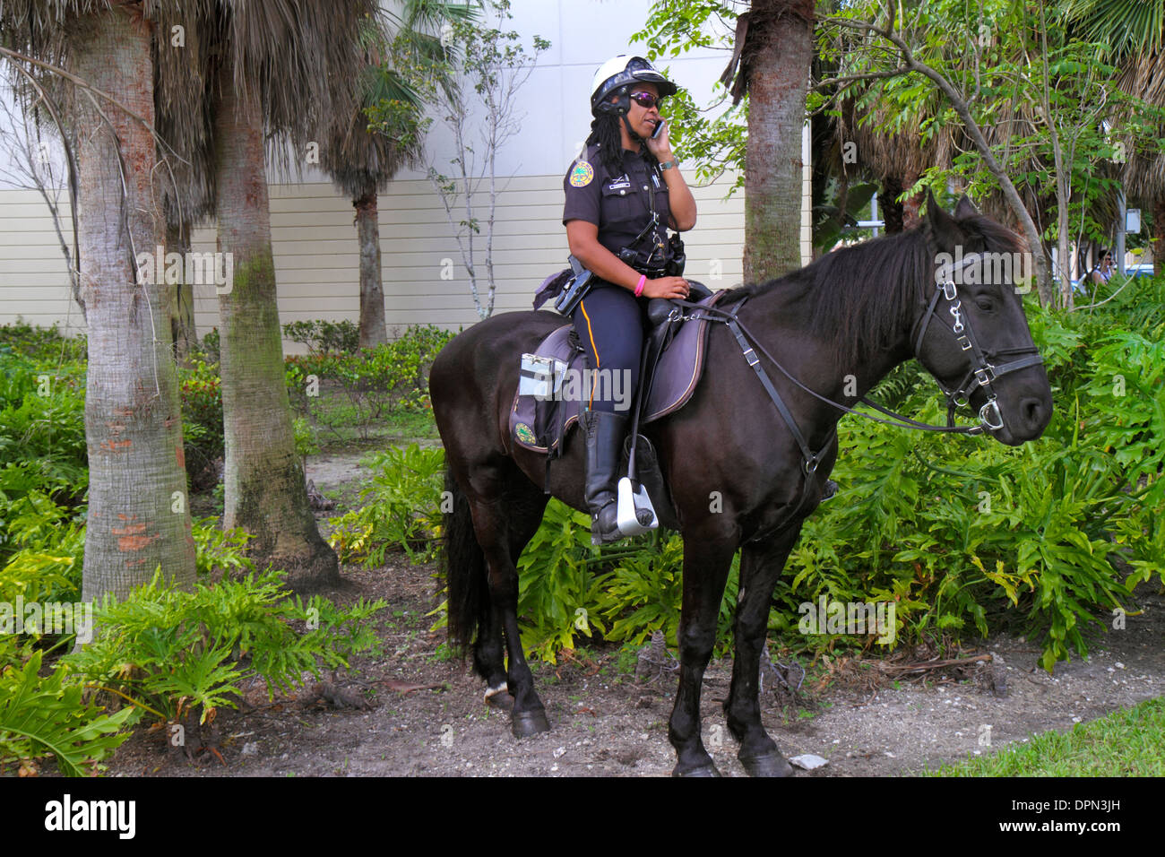 Miami Florida,Midtown,police,policewoman,Black woman female women,horse,horseback,patrol,FL131231163 Stock Photo