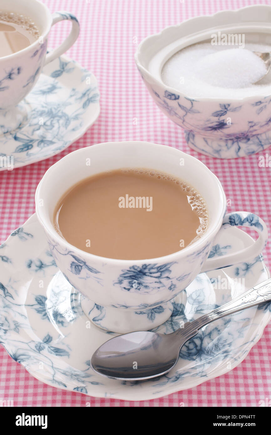 English tea served with milk in a floral tea service Stock Photo