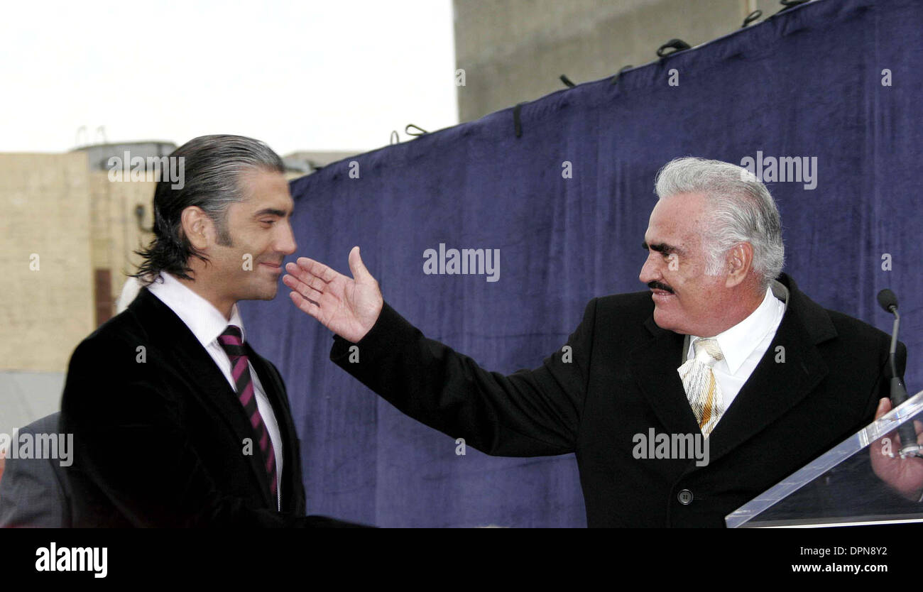 Dec. 2, 2005 - Hollywood, CALIFORNIA, USA - ALEJANDRO FERNANDEZ JR AND HIS FATHER VICENTE FERNANDEZ, WHOSE STAR IS NEXT TO HIS -.ALEJANDRO FERNANDEZ JR IS HONORED WITH THE 2296TH STAR ON THE HOLLYWOOD WALK OF FAME -.6160 HOLLYWOOD BOULEVARD, HOLLYWOOD, CALIFORNIA - .12-02-2005 -. NINA PROMMER/   2005.K45867NP.(Credit Image: © Globe Photos/ZUMAPRESS.com) Stock Photo