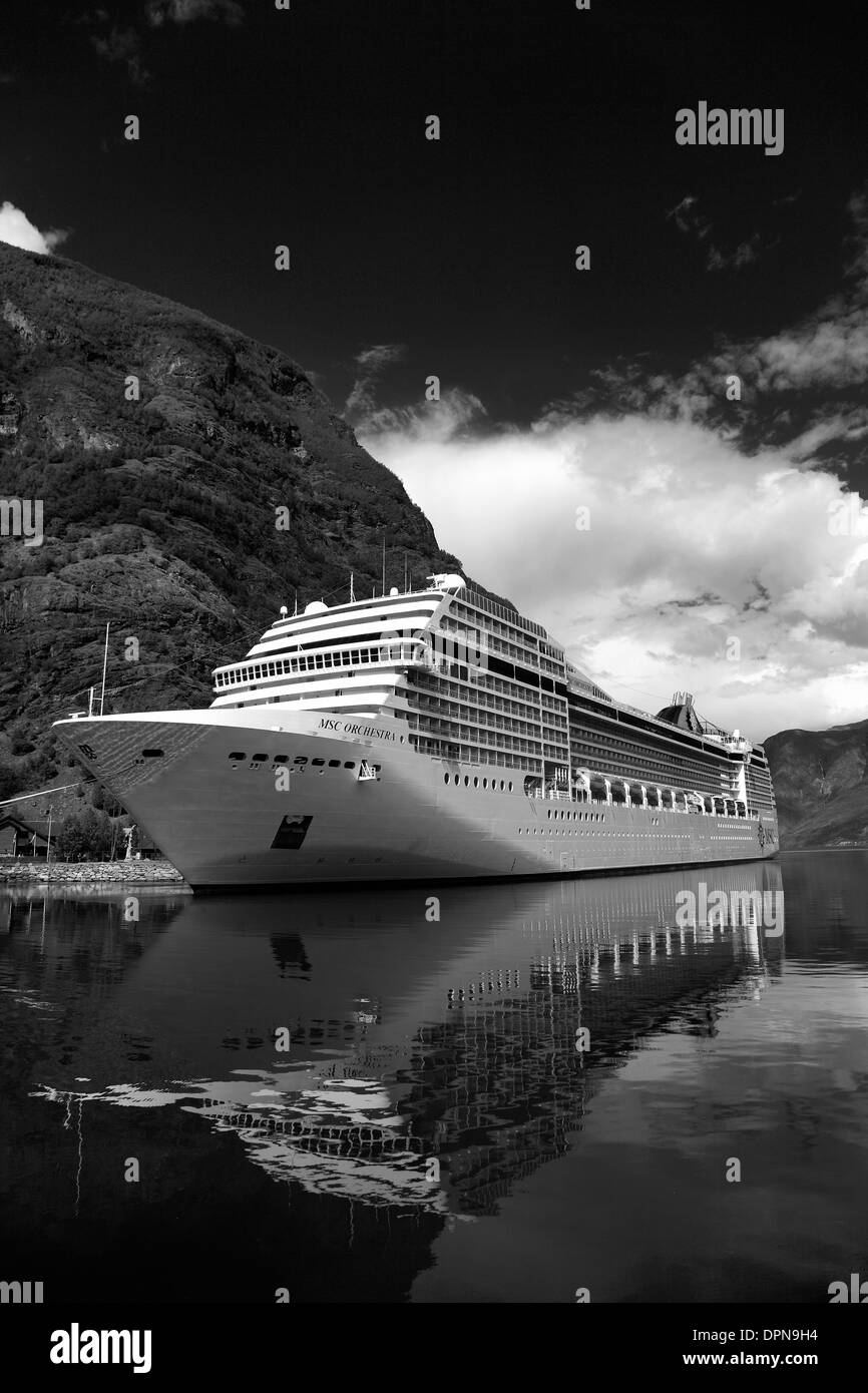 Cruise ship MSC Orchestra, harbour at the town of Flam, Aurlandsfjorden Fjord, Norway, Scandinavia, Europe. Stock Photo