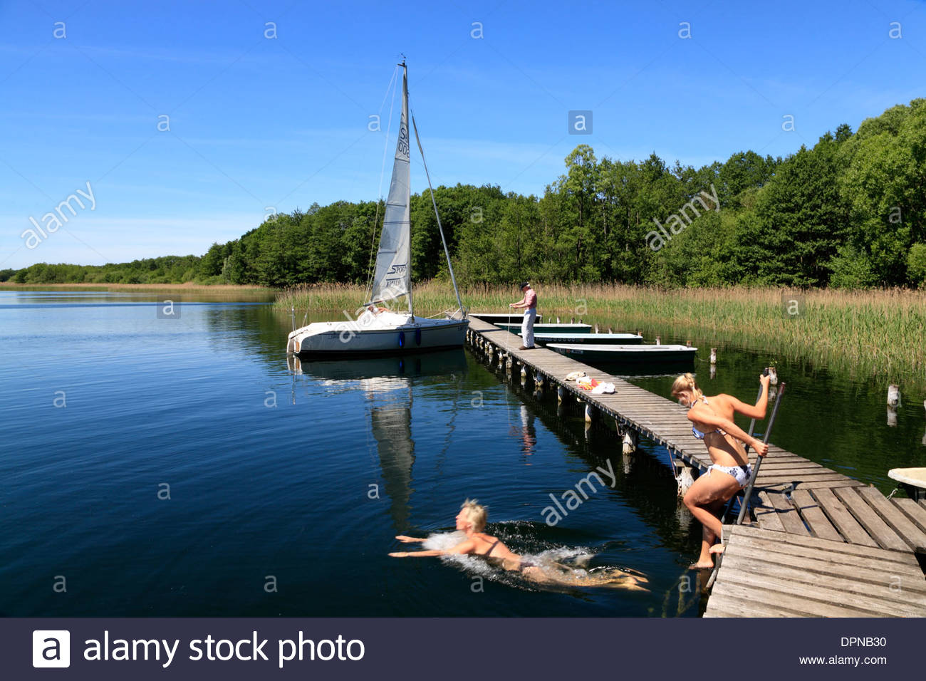 Little pier at Lassahn, Schaalsee lake, Mecklenburg Western Pomerania, Germany, Europe Stock Photo
