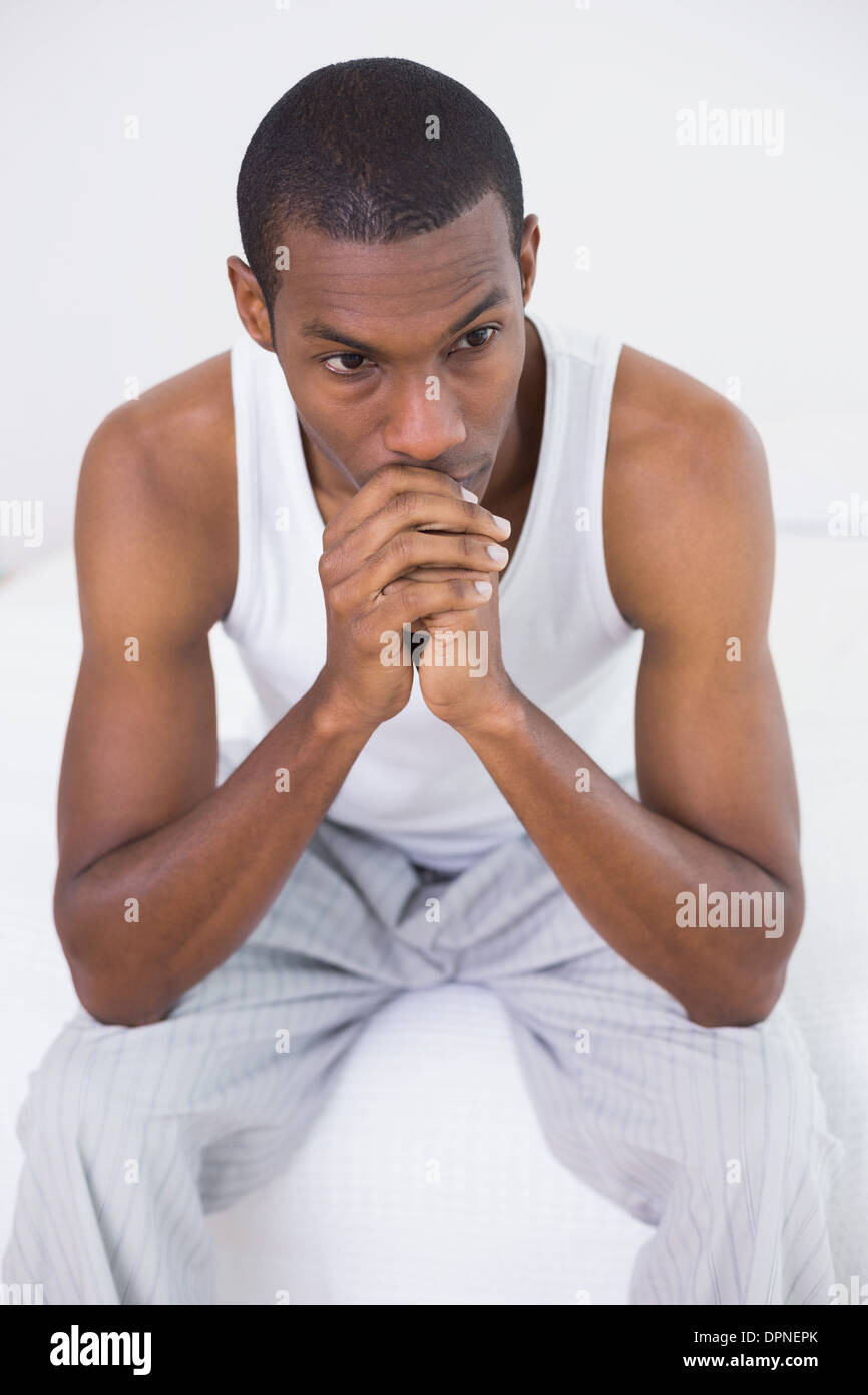 Pensive black man sitting hi-res stock photography and images - Alamy