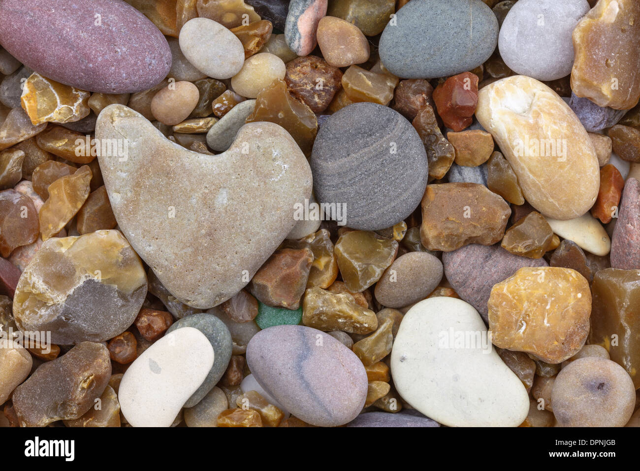 Heart of stone on a pebble Stock Photo